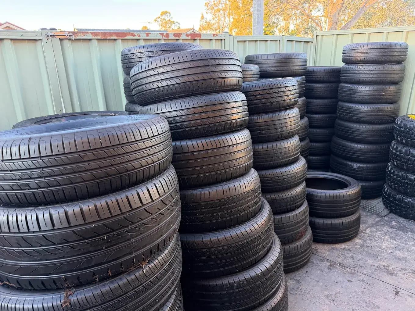 Rows of stacked used tyres at the Auswide Tyres yard in Austral